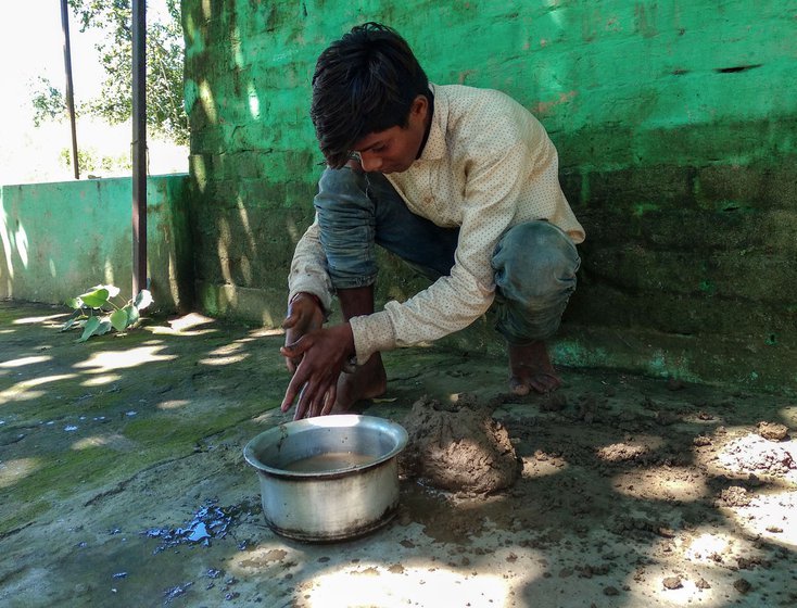 He is crafting pellets (right) from wet clay