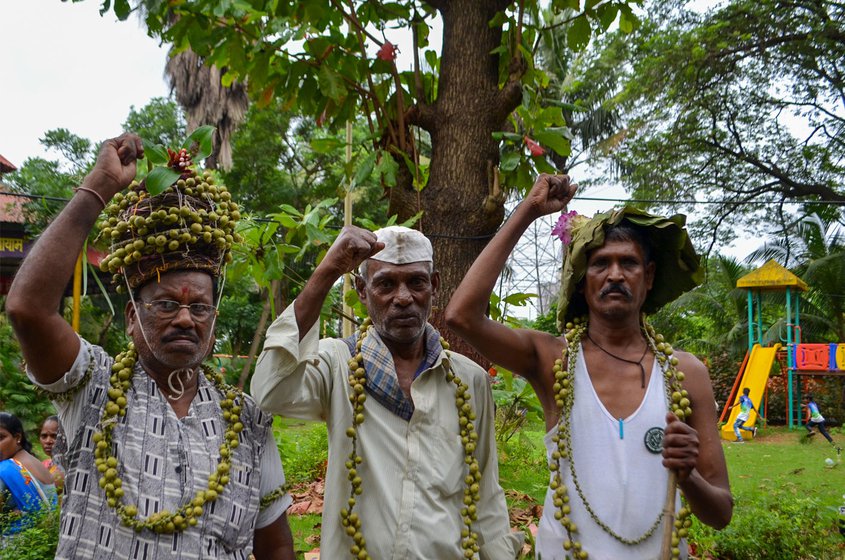 Right: Ladkya Dawde (left), Prabhu Thakar and Raghu wearing garlands of beral