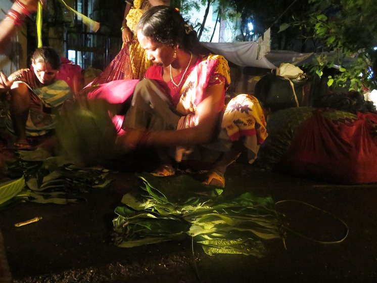 Tulshi making bundles beside the road