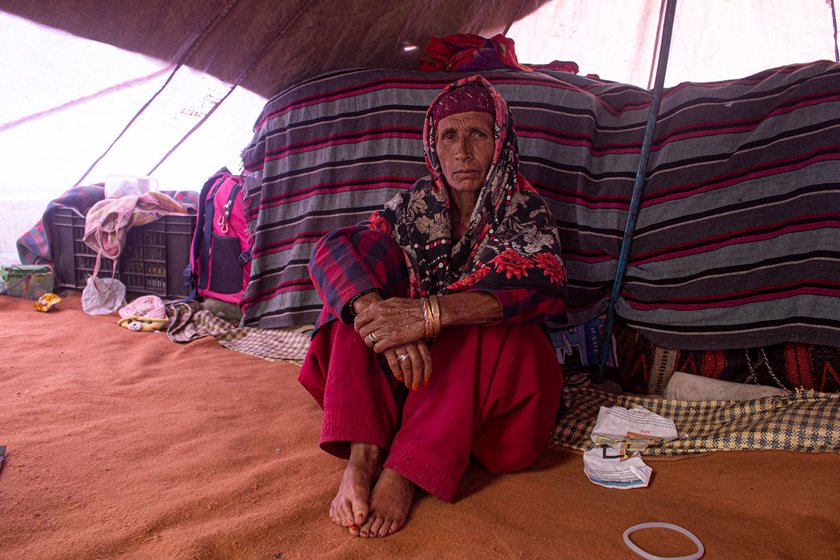 Right: Zabaida Begum, Abdul Latief's wife is resting in the tent.