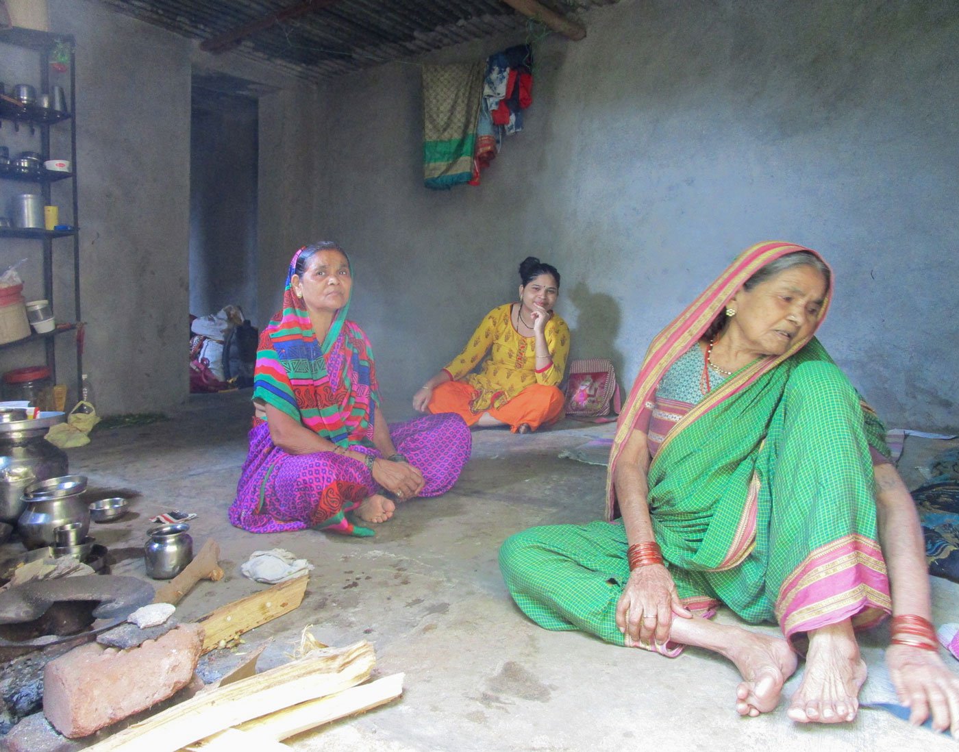 Vandana and Shridevi with Gunamay inside her home. When she fell ill in 2018, Gunamay had to leave the village to go live with her daughters