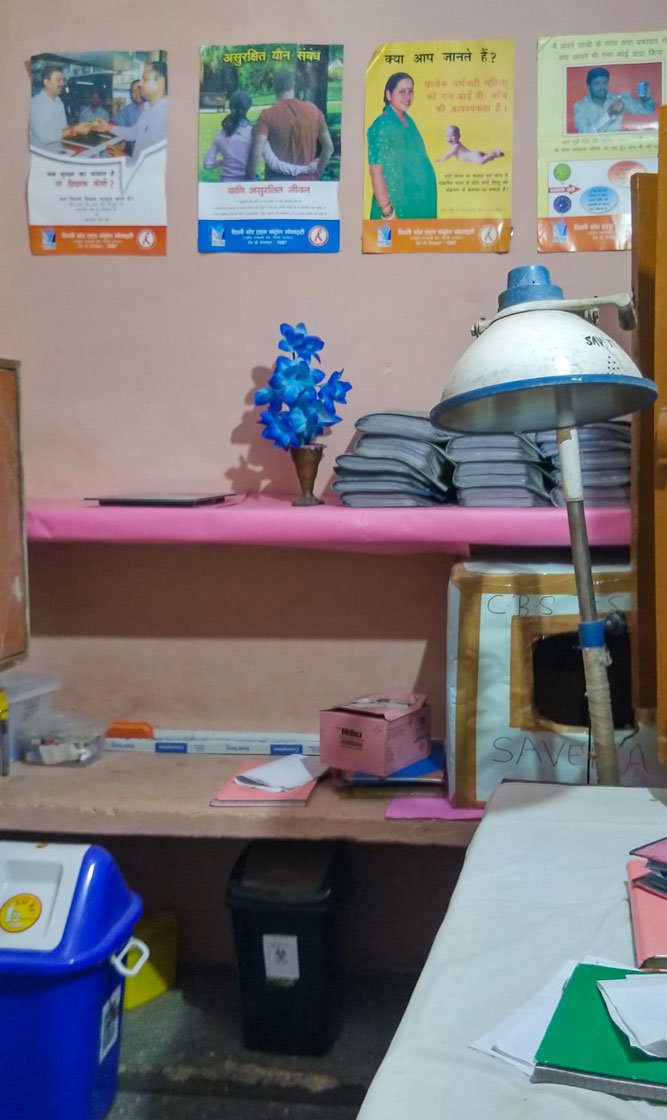 A room at the office of an NGO, where a visiting doctor gives sex workers medical advice and information about safe sex practices