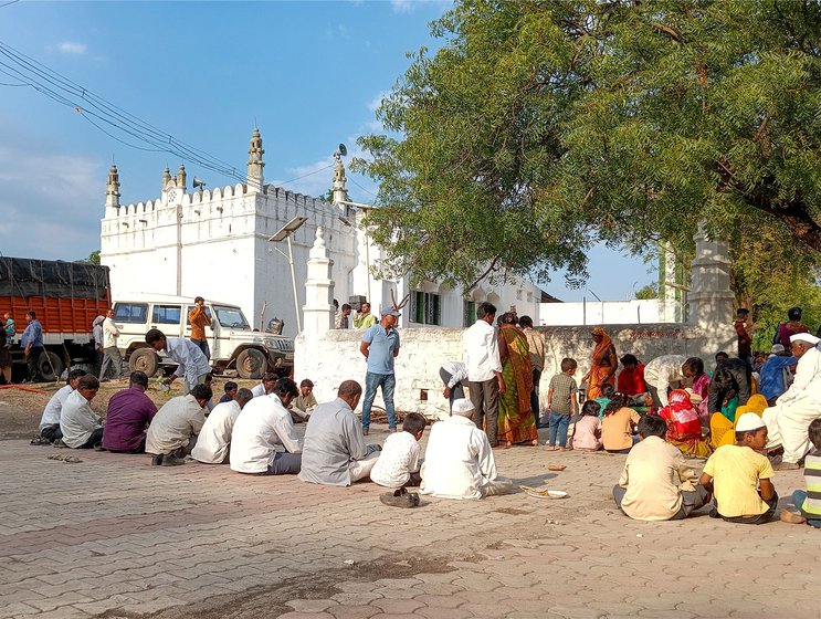 Right: People eating at a kanduri feast organised at the dargah in Moha, Osmanabad district