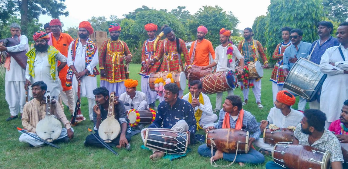A group of performing musicians: masak (bagpipe), sarangi (bow string), chimta (percussion) and dafli (bass hand drum)