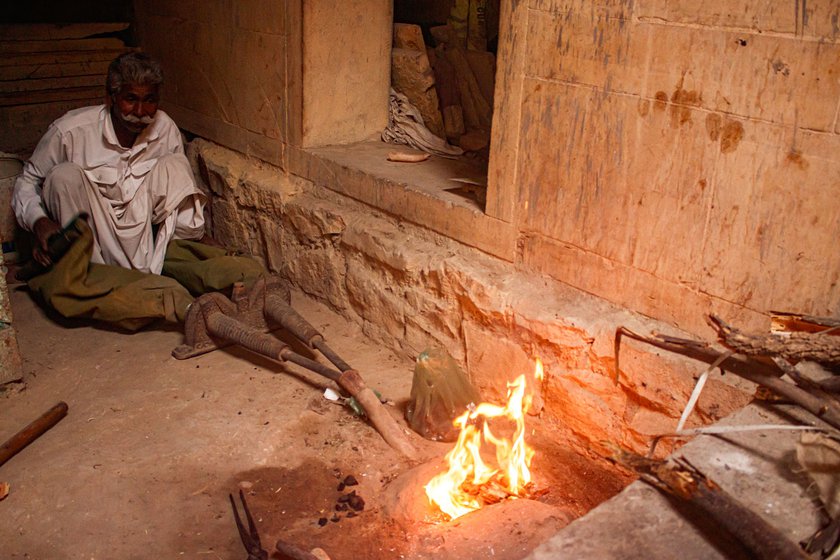 Mohanlal’s family uses a traditional blacksmith forge called dhaman (left) to shape metals . The dhaman is 'at least 100 years old and works perfectly,' he says. With rising temperature, the forge produces a lot of smoke (right), which causes breathing and coughing problems, says Mohanlal