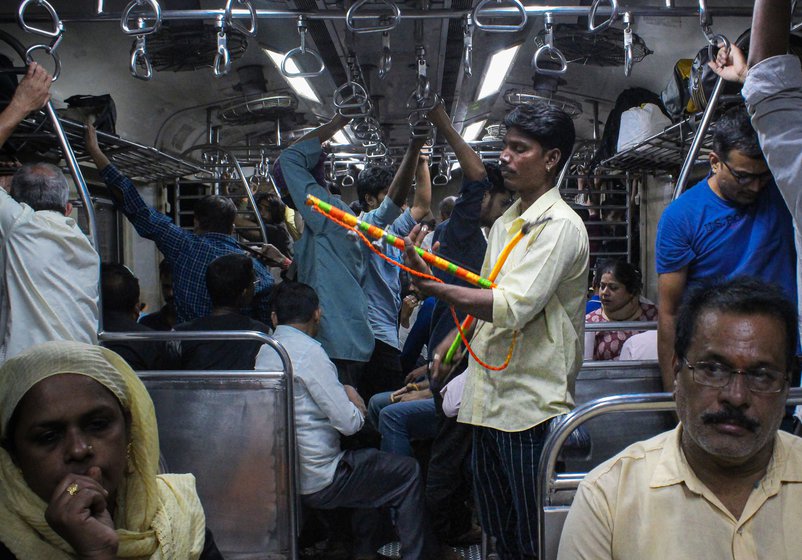 Right: Kishan moves between stations and trains in search of a reasonably good crowd and some space for him to play