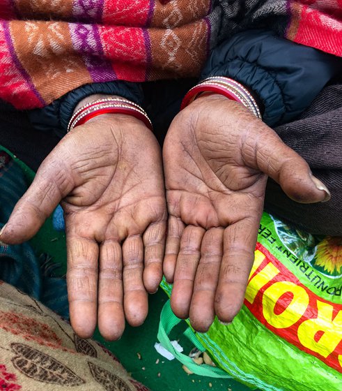 Pamanjeet Kaur, 40, a Dalit labourer from Singhewala village in Malout tehsil of Muktsar district, Punjab, was among the 300 women members of Punjab Khet Mazdoor Union who reached on the outskirts of the national capital on January 7. They all returned to Punjab on January 10. Right: Paramjeet's hands