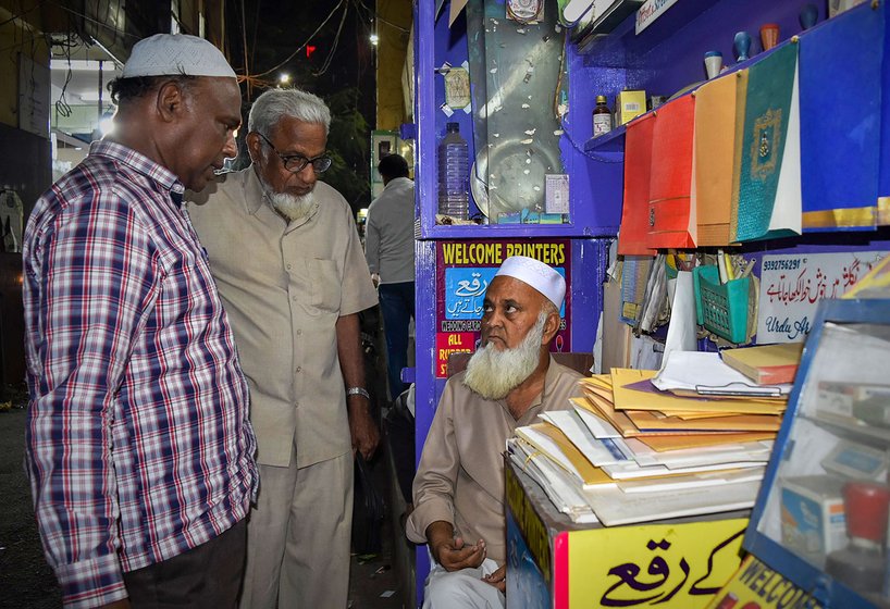 Muhammad Abdul Khaleel Abid talking to customers