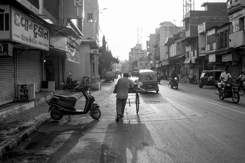 Mohamad bhai pushing his repairing cart through lanes in Saraspur