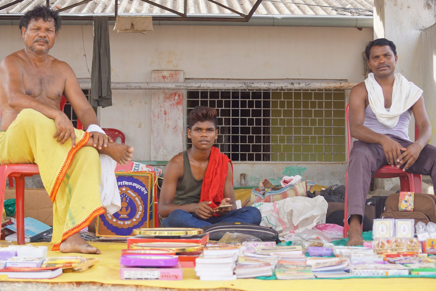 Rampyari Kawachi (attired in yellow) and his helpers selling books on a hot summer afternoon at an Adivasi mela in Sukma district