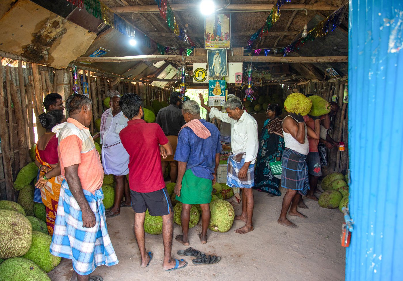 Buying, selling, fetching and carrying of jackfruits at a mandi in Panruti