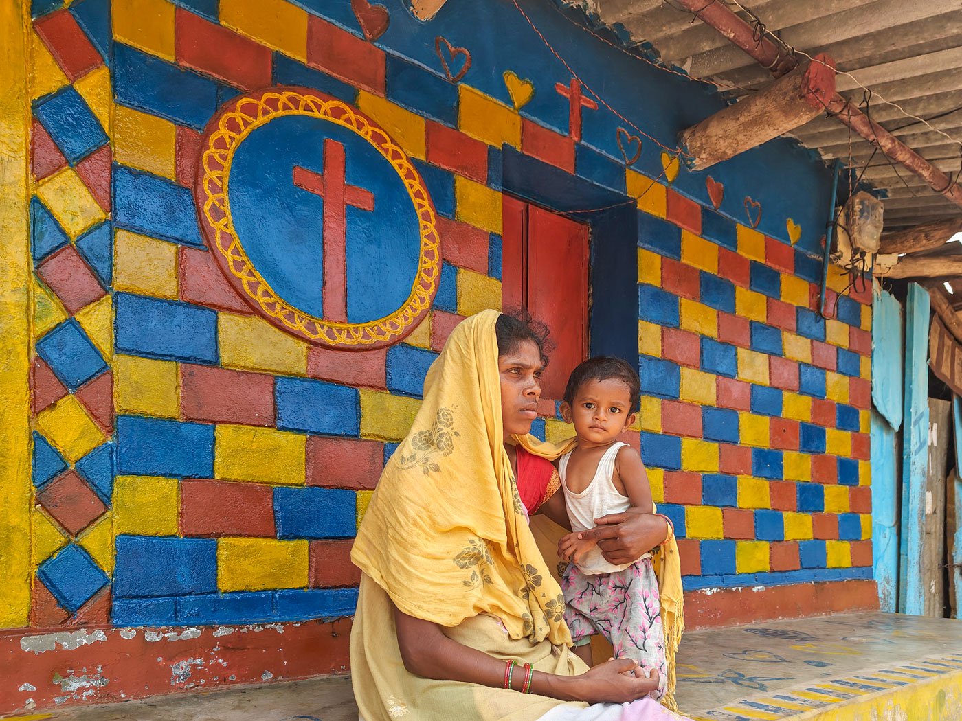 Arracote is a small village with a population of just over 2,500. 'In moments like these you expect people in your village to provide emotional support,' says Sukmiti, seen here with her newborn in front of the house.