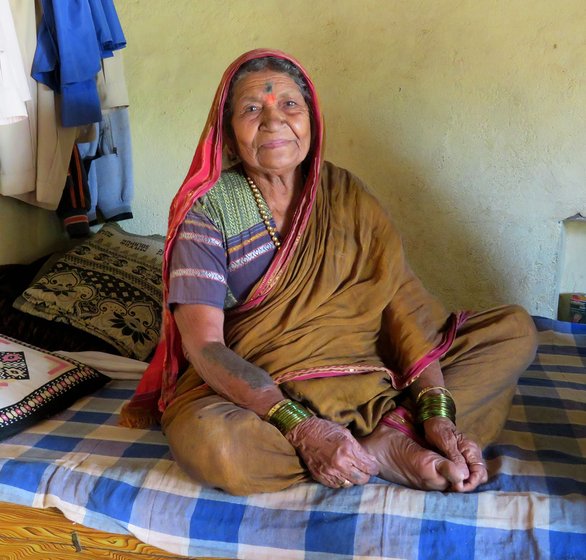 Shirmabai Kore sitting on her bed