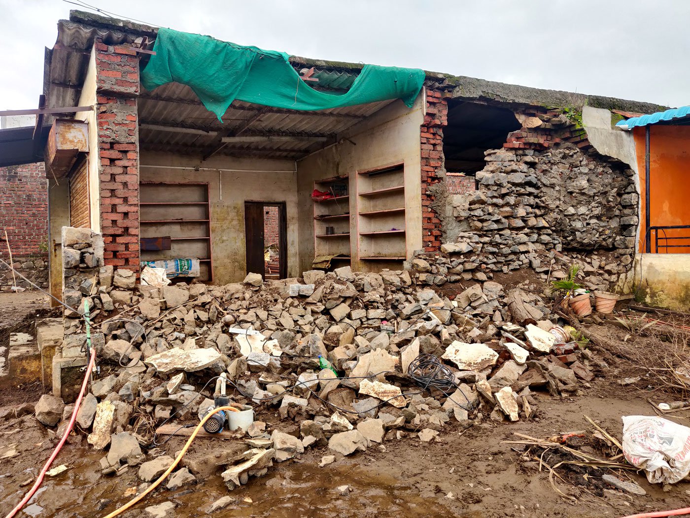 A house in Khochi village that was damaged in the 2019 and 2021 floods