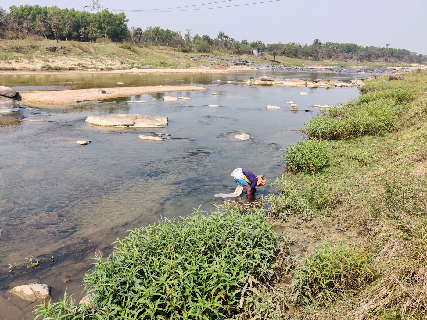 Kangsabati river, which flows through Kaira in Puruliya's Puncha block, is a major source of food for Adivasi families in the village