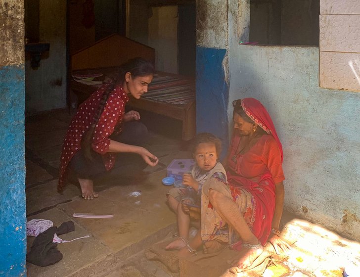 Dinesh is left with two sons, three-year-old Chirag (in the photo with relatives) and Devansh, who was just 29 days old when Bhavna, his mother, died of a punctured intestine 

