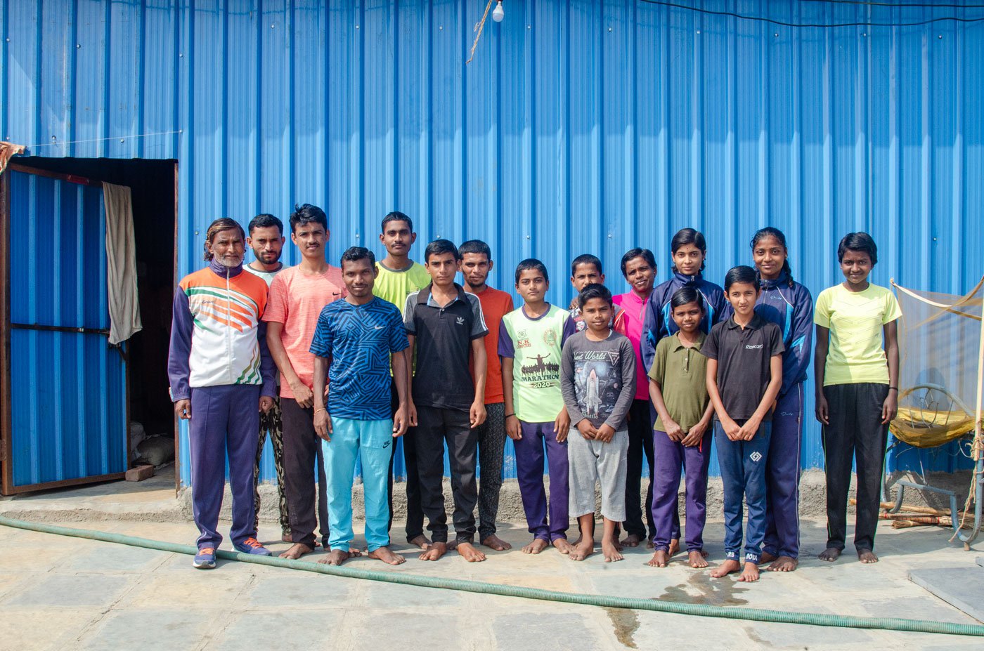 The tin structure of the academy stands in the middle of fields, adjacent to the Beed bypass road. Athletes from marginalised communities reside, study, and train here