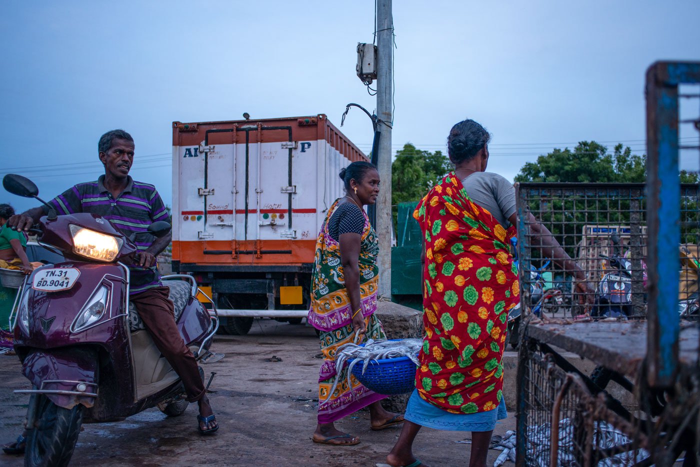 Visalatchi with one of her workers carrying freshly purchased fish. She paid the workers a daily wage of Rs. 300 with lunch and tea