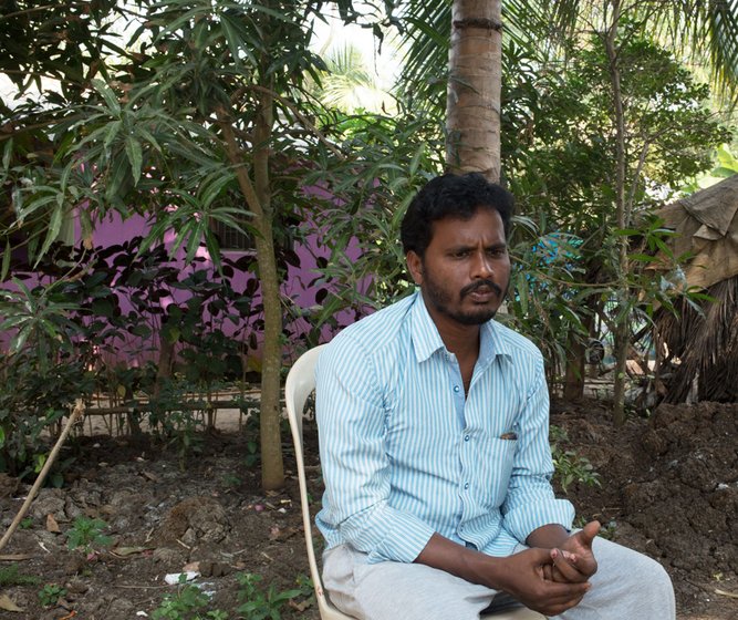 A man sitting on a chair outdoors