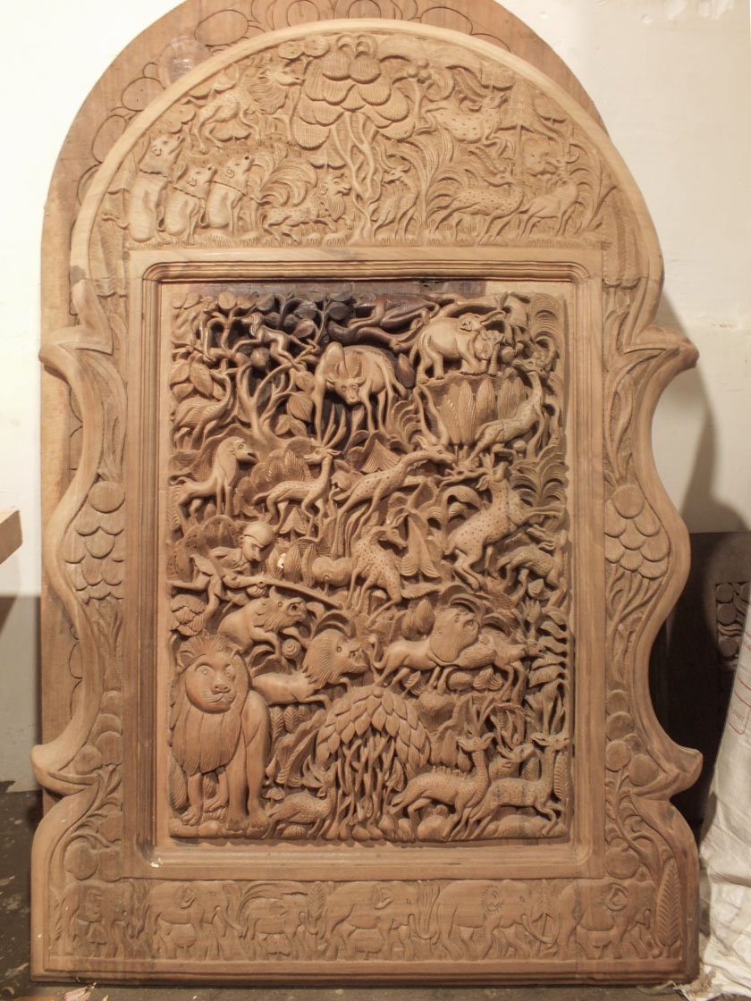 Left: Ghulam carves wooden jewellery boxes, coffee tables, lamps and more. This piece will be fixed onto a door.