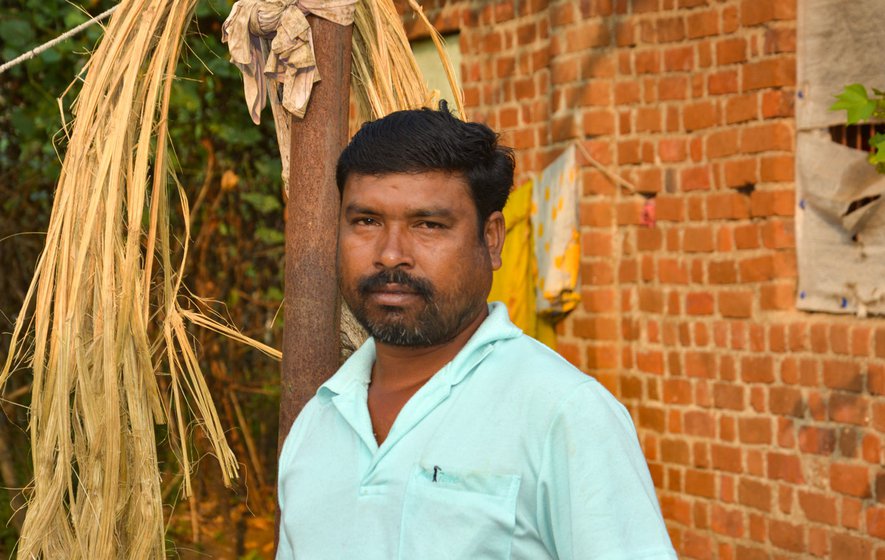 Balakrushna Lipat outside his house in Nimbavali