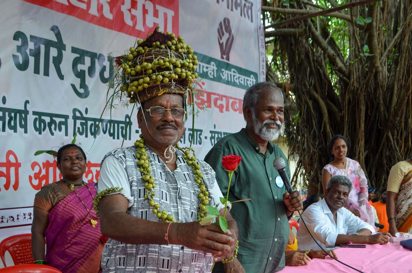 Left: Ladkya Dawde (holding a rose)  with Vitthal Lad, the founder of Kashtakari Shetkari Sanghatana.