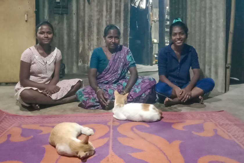 Left: Suman with her daughters Namrata Bandu Sambre (left) and Kavita Bandu Sambre (right), and the cats in her home.