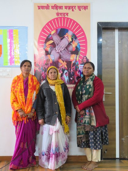 Left: Teena Garasia (green sweater) heads Banswara Livelihood Bureau's Migrant Women Workers Reference Center; Anita Babulal (purple sari) is a Senior Associate at Aaajevika Bureaa, and Kanku (uses only this name) is a sanghatan (group) leader. Jyotsana (standing) also from Aajeevika, is a community counselor stationed at the police station, and seen here helping families with paperwork