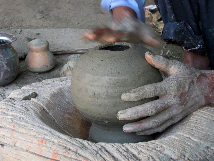 Sudama making a pot's base