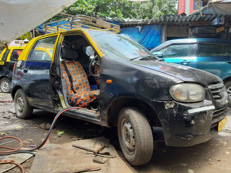 Krishnakant Pandey could not move out his taxi (which too was later auctioned) because he didn't have money to repair the engine, and had started plying his deceased brother’s dilapidated cab (right)