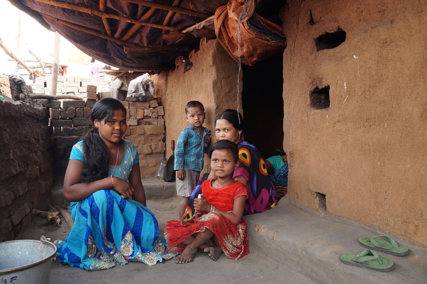 Left: Joyanti Parabhue (standing) with other workers. Right: Kirmani (in blue), Joyanti, Anjoli and Bosanth (in background), in the cooking area of Joyanti's hut