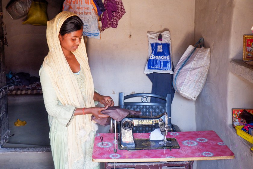 Right: Renu’s sister Priyanka stopped studying after Class 12 as the family could not afford the fees. She has recently borrowed a sewing machine from her aunt, hoping to earn a living from tailoring work