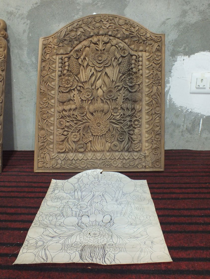 Right: Ghulam has drawn the design and carved it. Now he will polish the surface to bring out a smooth final look