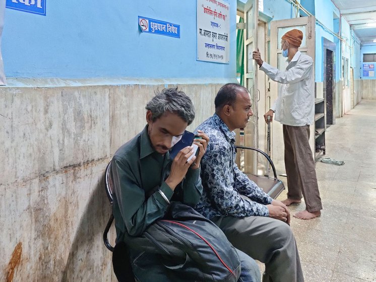 The door to the dialysis room prohibits anyone other than the patient inside so Dnyaneshwar (right) must wait  outside for Archana to finish her procedure