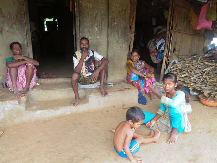 Many in Shahapur speak of falling paddy yields. Right: '...the rain is not trustworthy,' says Malu Wagh, with his wife Nakula (left), daughter-in-law Lata and her nieces


