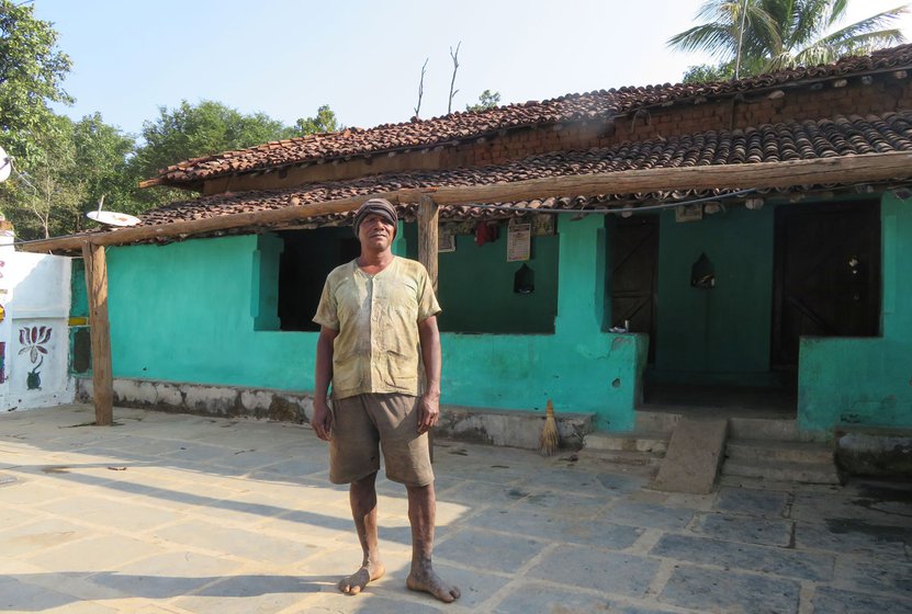 Outside his three-room house in Jabarra village