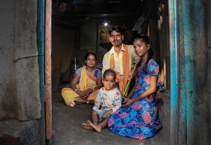 Right: Kishan with his wife Rekha and two children, Yuvraj and Bharati