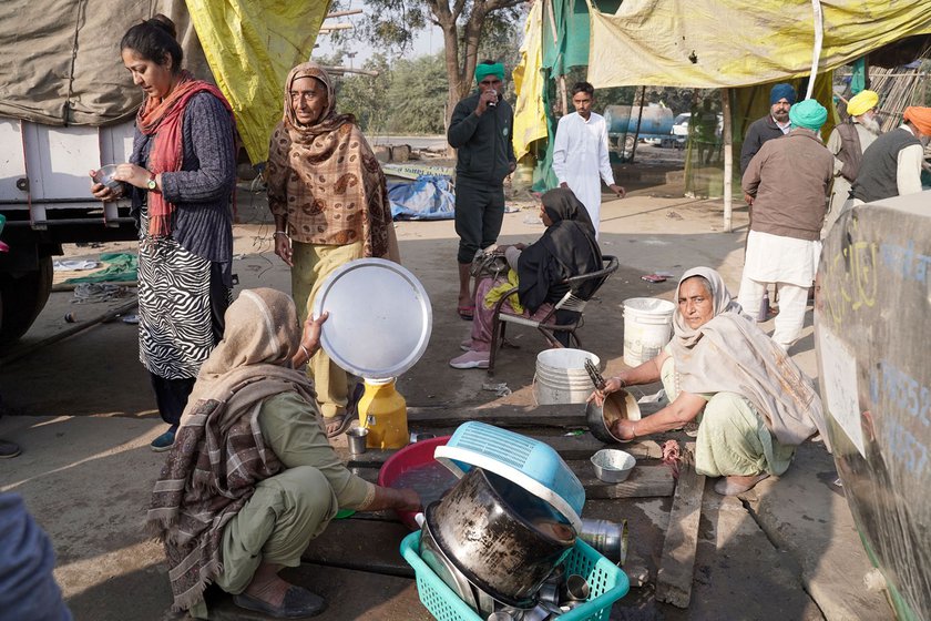 With other other farm protesters from her village washing utensils to pack in their tractor-trolley