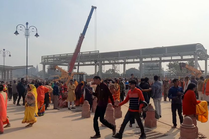 Right: Devotees lining up at the main entrance to the Ram temple site