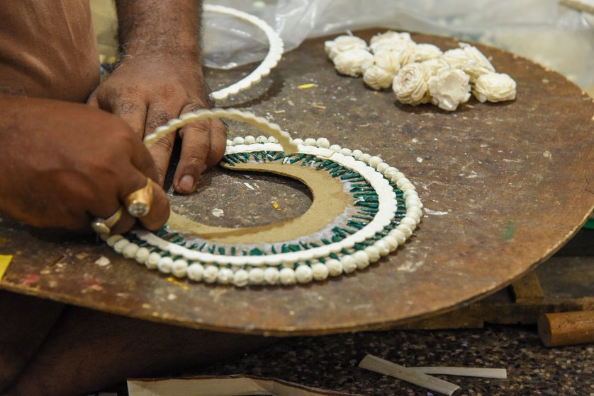 The second strip of sholapith being added to the crown