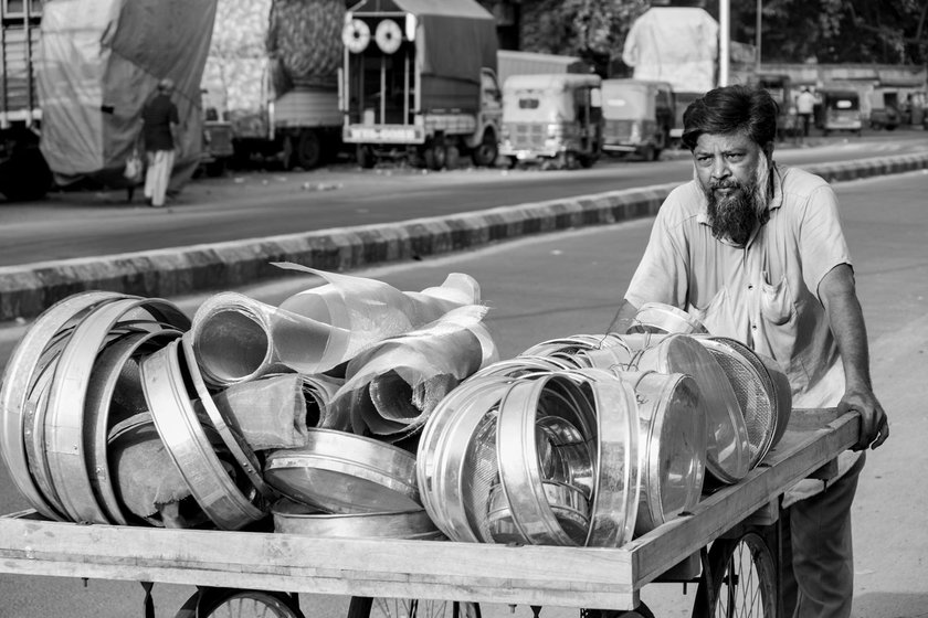 Mohamad bhai pushing his repairing cart through lanes in Saraspur