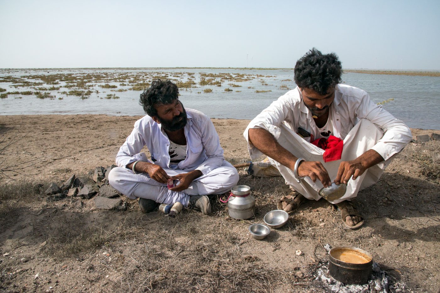 Jethabhai Rabari (left) and Dudabhai Rabari making tea after grazing their camels in Khambaliya
