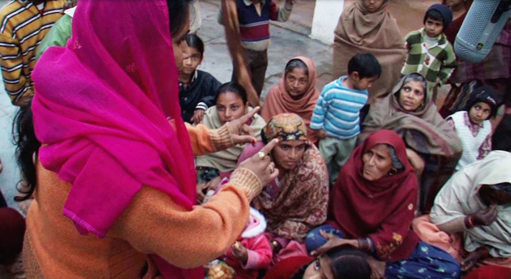 Left: Addressing a meeting, discussing the relative ‘merits’ of sons and daughters