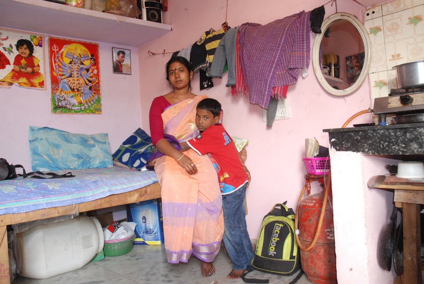 Left: Their son, Amit, 9, with his father's photograph: ' I will become an engineer and develop technology that will prevent humans cleaning gutters' Right: 'Caste matters',  says Putul. 'I cannot get my husband back. I want only that no one else should have to face this ordeal '