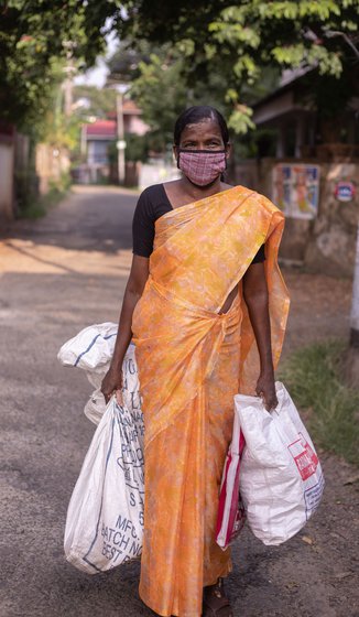 Left: After collecting the coconuts, Thankamma packs her working clothes and quickly changes into a saree to make it for the bus on time.