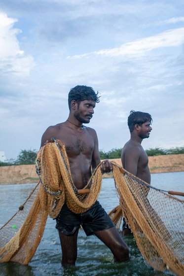 Left: Malkalai (foreground) and Singam hauling nets out of the water.