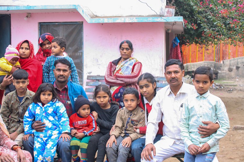 Left: The Qureshi and Saini families gathered together: Anmol (on the extreme right), Sonali (in a red jumper), Abdul (in white), Gudiya (in a polka dot sari) and others.