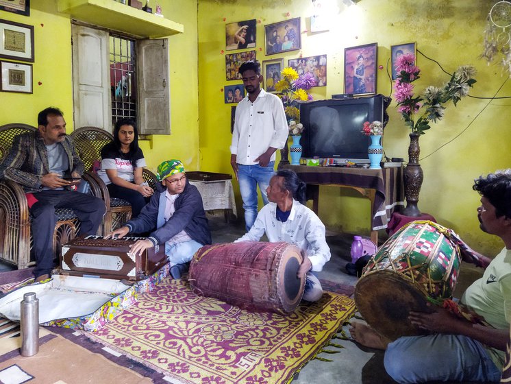 Durga Prasad Das instructing his band during a practice session