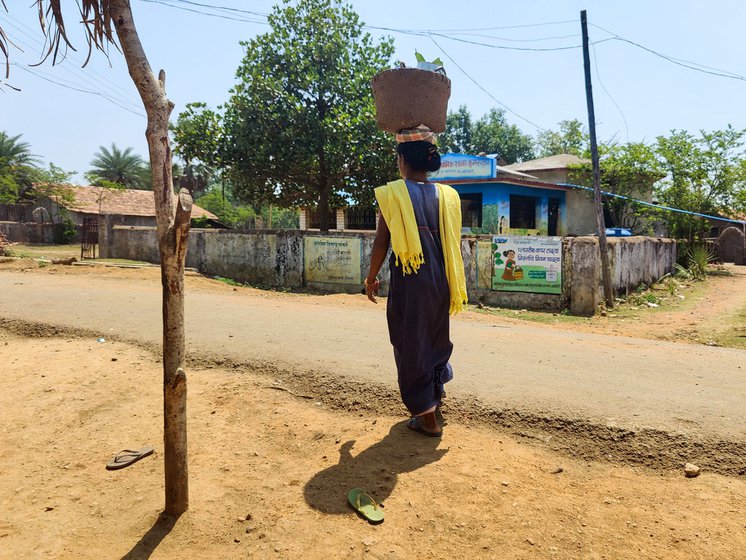 Left: In blistering summer heat, Saru carries lunch to her parents-in-law and husband working at the family farm. When she has her period, she is required to continue with her other tasks such as grazing the livestock.