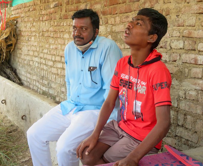 Left: Vaibhav with his schoolteacher, Mohan Talekar.